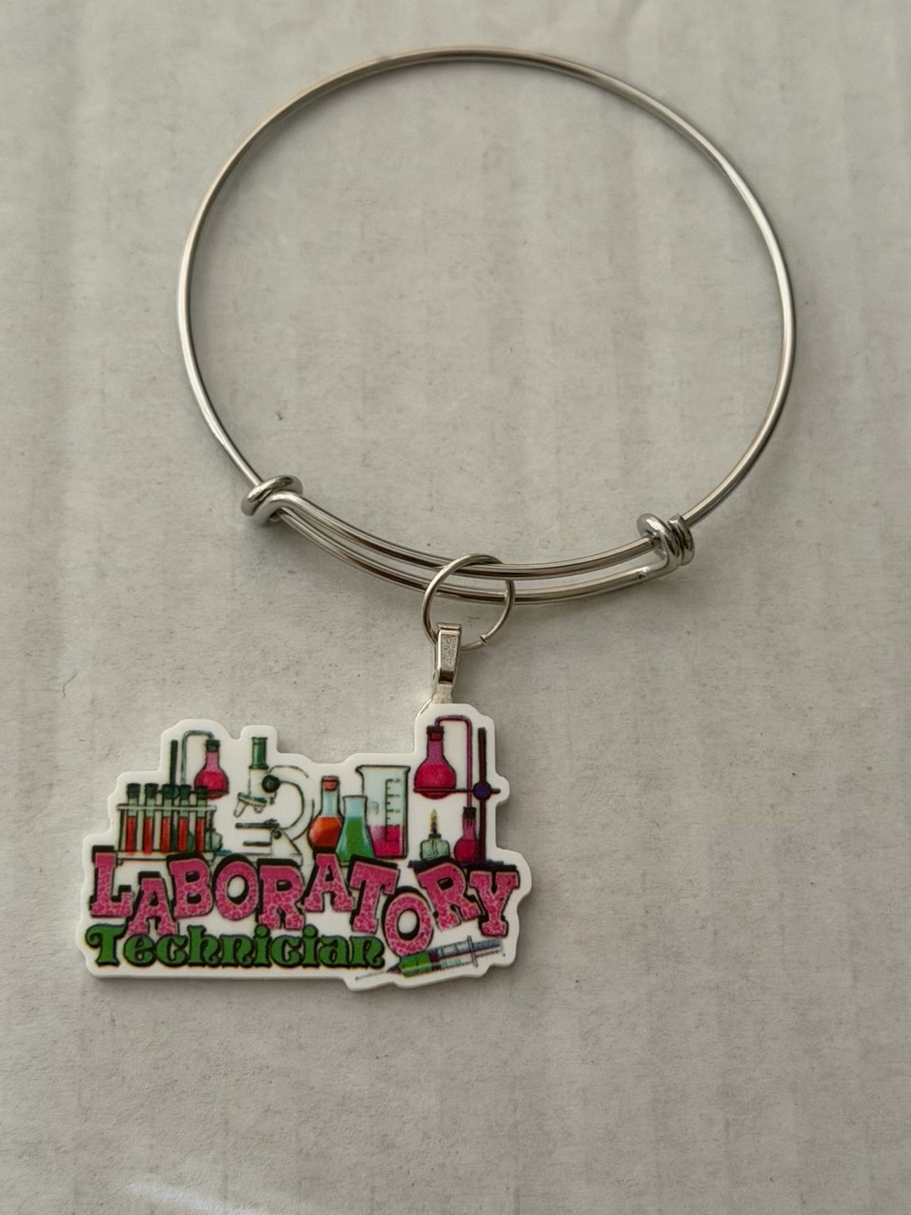 Silver Bangle Bracelet with Laboratory Technician Charm - Pink & Green Accents